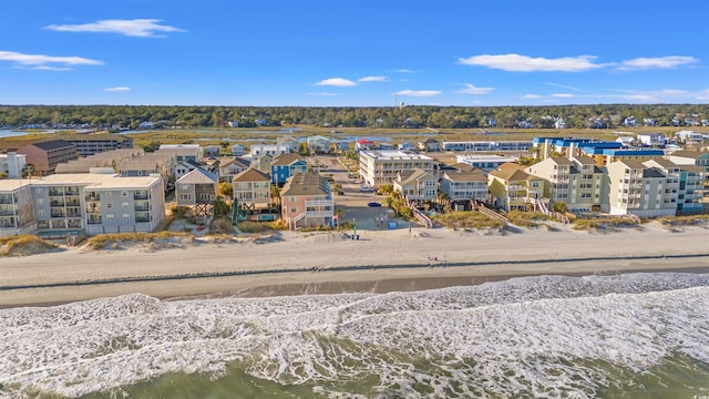 aerial view with a water view and a view of the beach