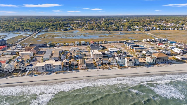 birds eye view of property with a view of the beach and a water view