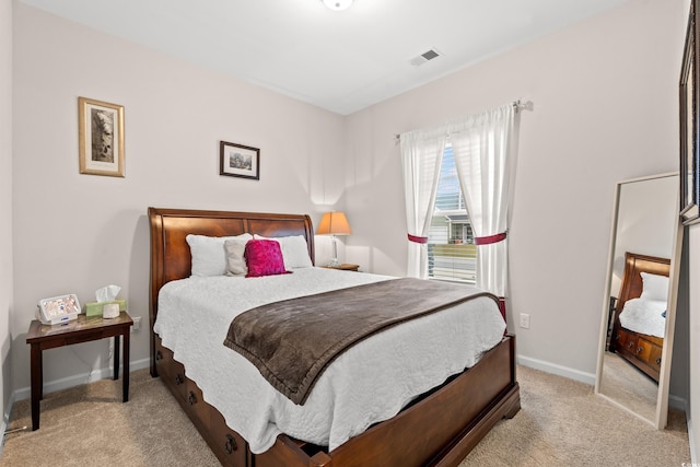 bedroom featuring visible vents, baseboards, and carpet flooring