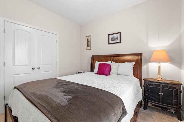 carpeted bedroom featuring a closet