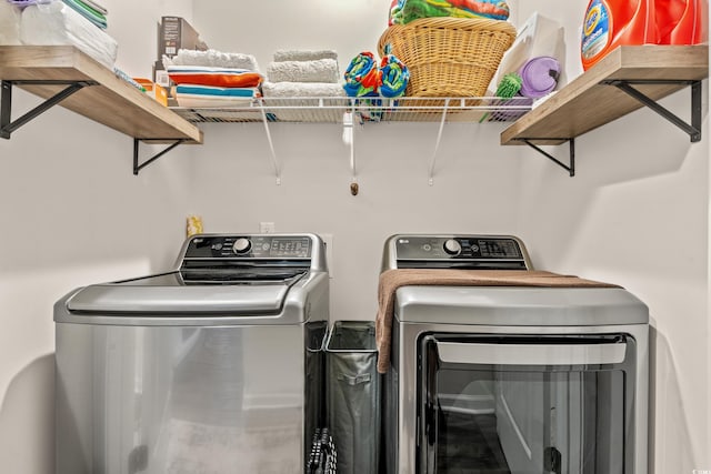 clothes washing area with independent washer and dryer