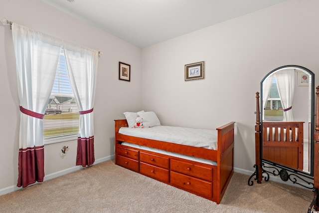 bedroom featuring baseboards and carpet floors