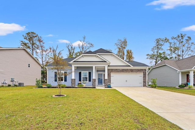 craftsman house with central AC, a front yard, and a garage