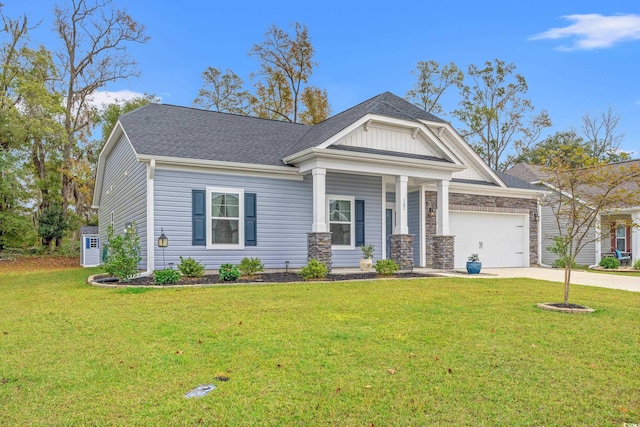 view of front of house featuring roof with shingles, a front yard, stone siding, an attached garage, and concrete driveway