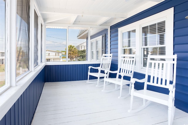 sunroom with beam ceiling and wood ceiling