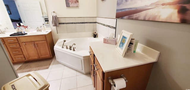 full bath featuring vanity, tile patterned flooring, and a bath