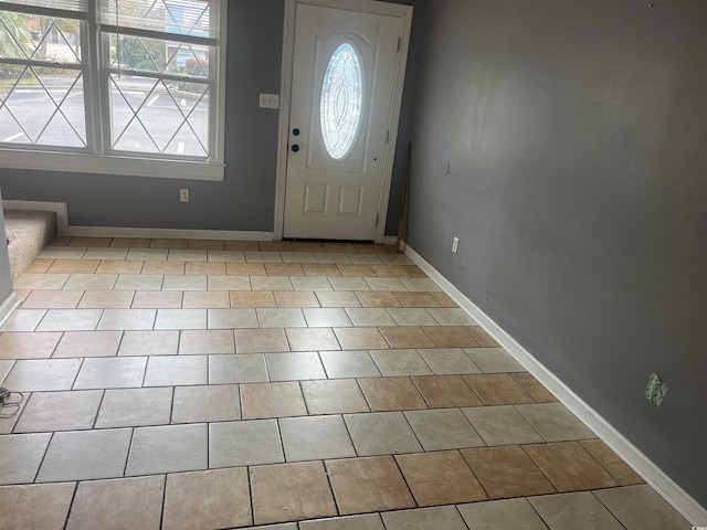 foyer featuring light tile patterned floors