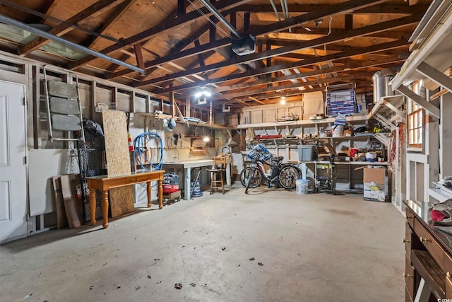 garage featuring a workshop area and a garage door opener