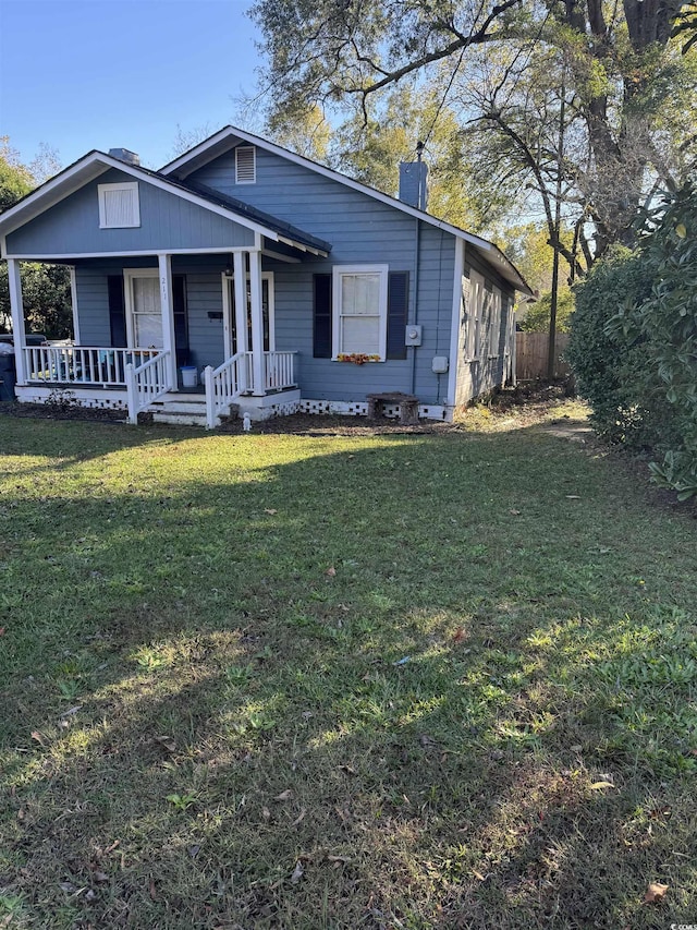 view of front facade with a porch and a front yard