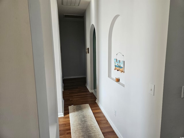 hallway featuring dark hardwood / wood-style flooring