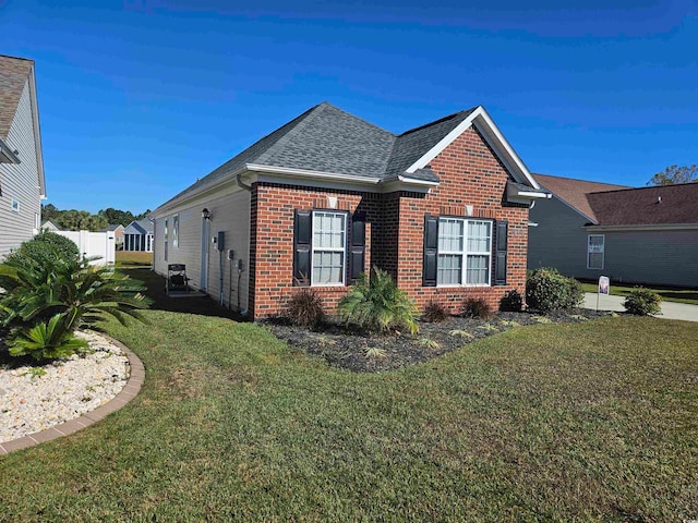 view of home's exterior featuring a yard