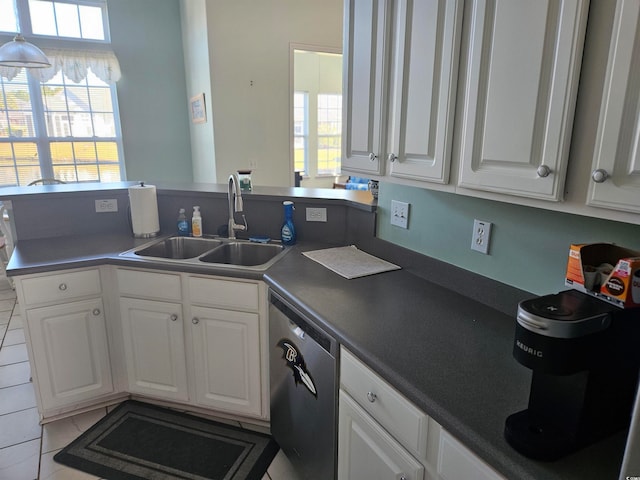 kitchen featuring dishwasher, white cabinetry, sink, and light tile patterned floors