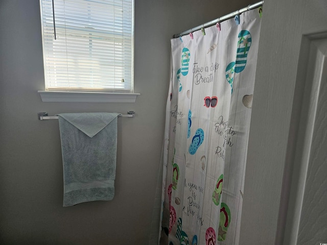 bathroom featuring a shower with curtain