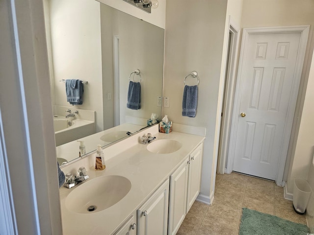 bathroom with tile patterned flooring and vanity