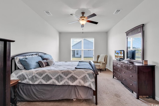 bedroom with ceiling fan and light carpet