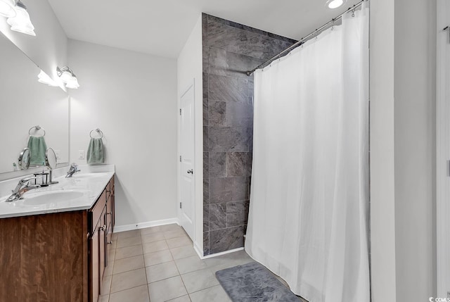 bathroom featuring a shower with curtain, vanity, and tile patterned floors