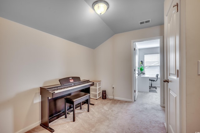 miscellaneous room with light carpet and lofted ceiling