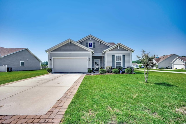 view of front of house with a garage and a front yard