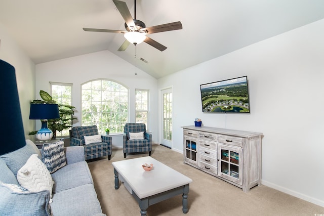 living room with ceiling fan, light colored carpet, and lofted ceiling