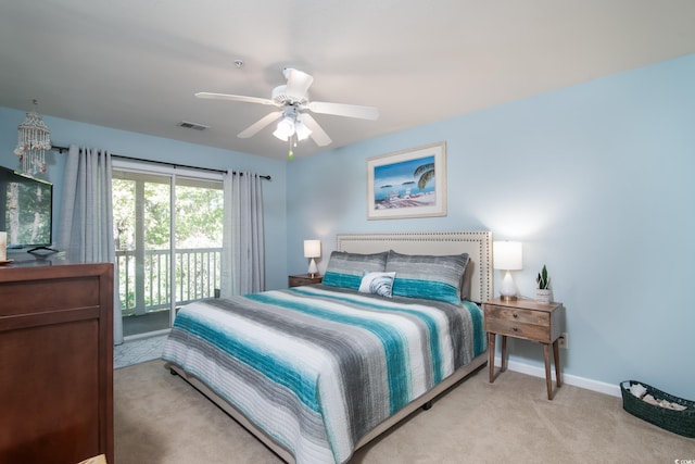 bedroom with access to exterior, light colored carpet, and ceiling fan