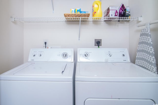 laundry room with washing machine and clothes dryer