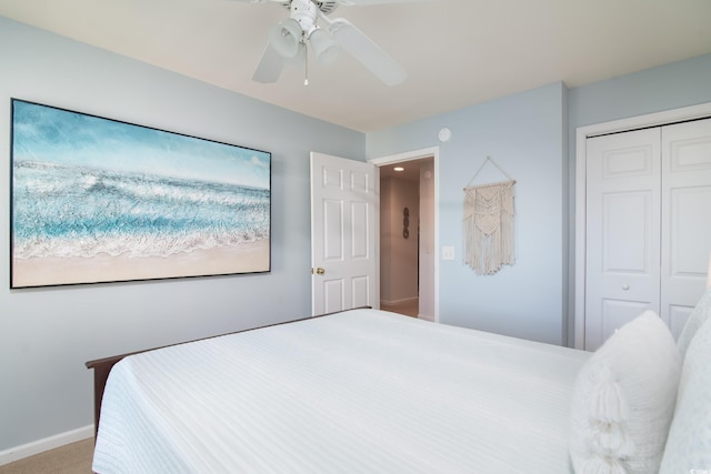 bedroom featuring carpet, ceiling fan, and a closet