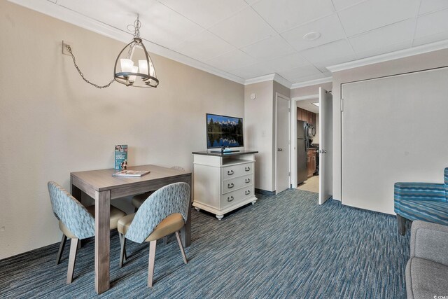 1105 S Ocean Blvd Unit 106, Myrtle Beach, SC 29577 - dining space featuring dark colored carpet and crown molding