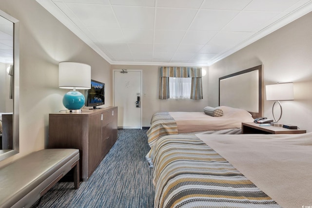 carpeted bedroom featuring ornamental molding