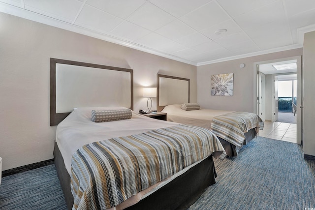 bedroom with carpet flooring and crown molding