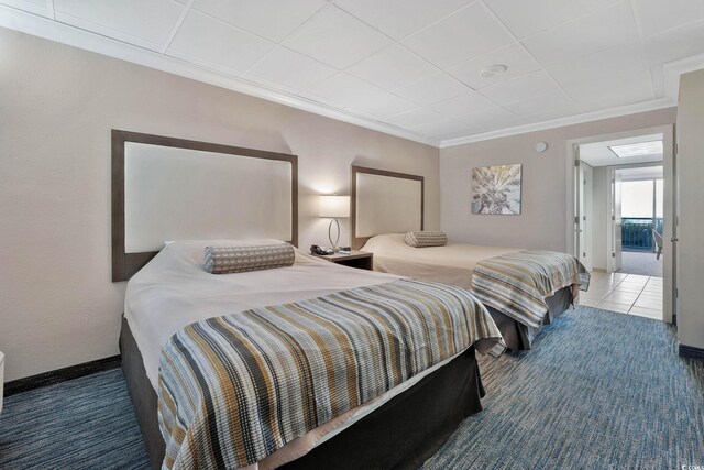 1105 S Ocean Blvd Unit 106, Myrtle Beach, SC 29577 - bedroom featuring ornamental molding, baseboards, and carpet flooring