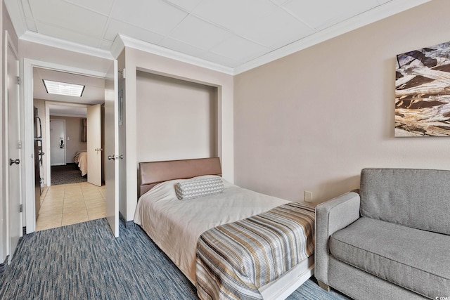 1105 S Ocean Blvd Unit 106, Myrtle Beach, SC 29577 - carpeted bedroom with crown molding and tile patterned floors