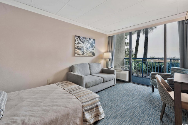 bedroom with access to outside, floor to ceiling windows, carpet flooring, and ornamental molding