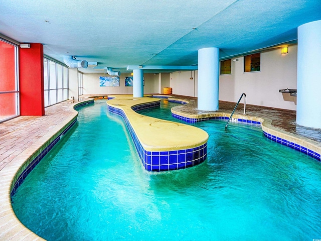 view of pool featuring a patio area