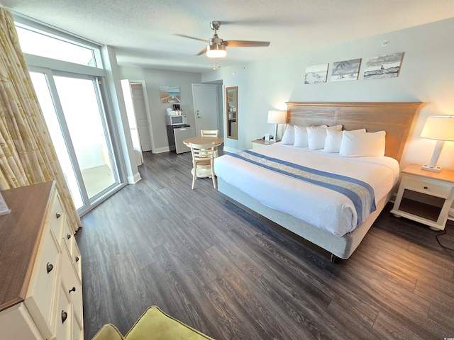 bedroom featuring ceiling fan, dark wood-type flooring, and a textured ceiling