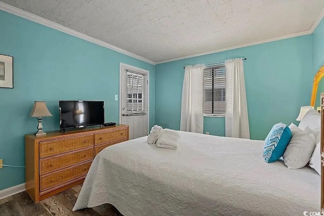 bedroom featuring crown molding, dark wood-type flooring, and a textured ceiling