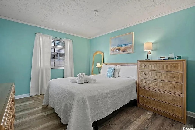 bedroom with dark hardwood / wood-style flooring, ornamental molding, and a textured ceiling