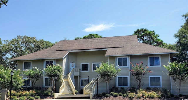 491 Ocean Creek Dr Unit 2614, Myrtle Beach, SC 29572 - view of front facade featuring stairway and roof with shingles