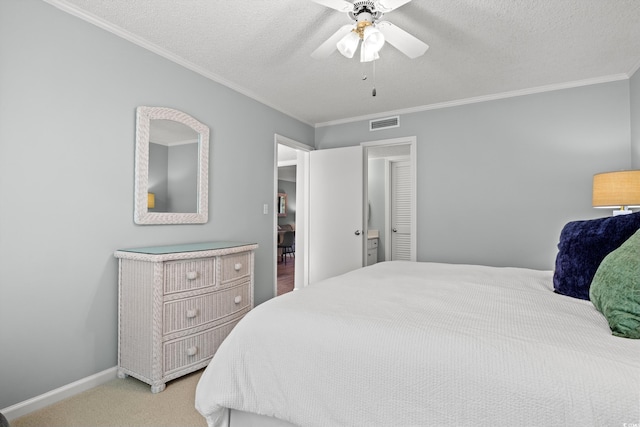 carpeted bedroom featuring ceiling fan, a textured ceiling, and ornamental molding