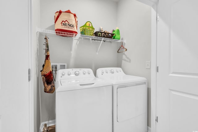 clothes washing area featuring washing machine and dryer