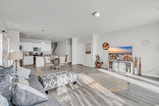 living room with light hardwood / wood-style floors