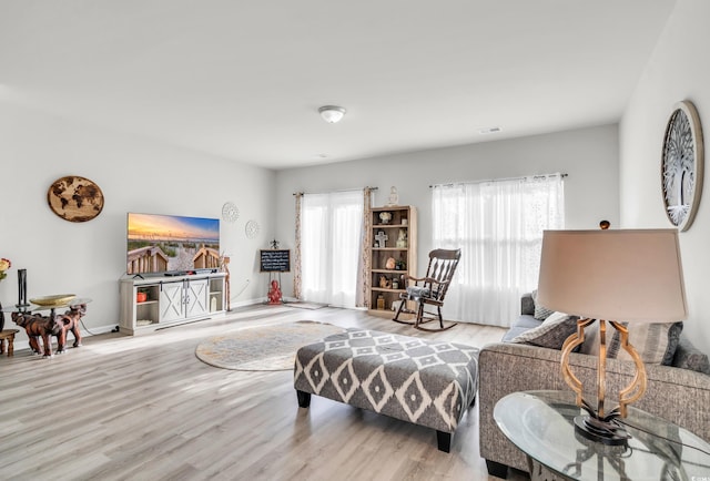 living room with light hardwood / wood-style flooring