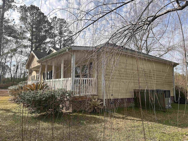 view of side of property featuring a porch