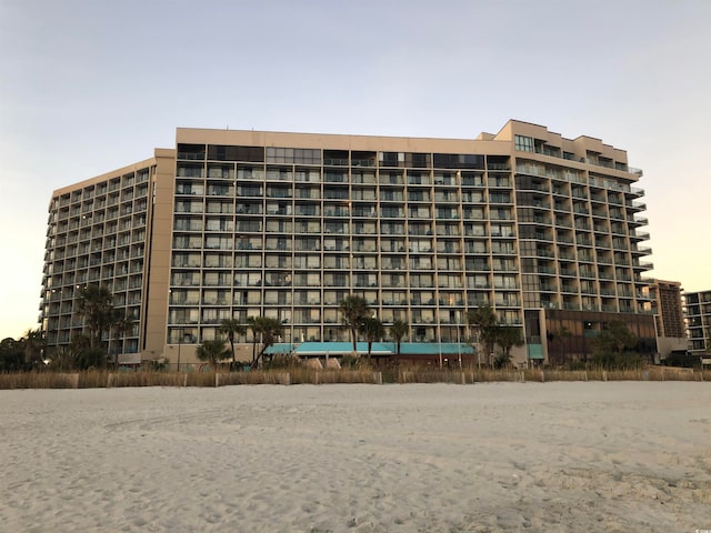 view of outdoor building at dusk