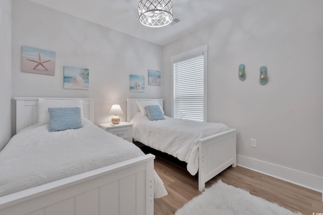 bedroom with light hardwood / wood-style flooring