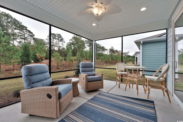 sunroom featuring a wealth of natural light and wood ceiling