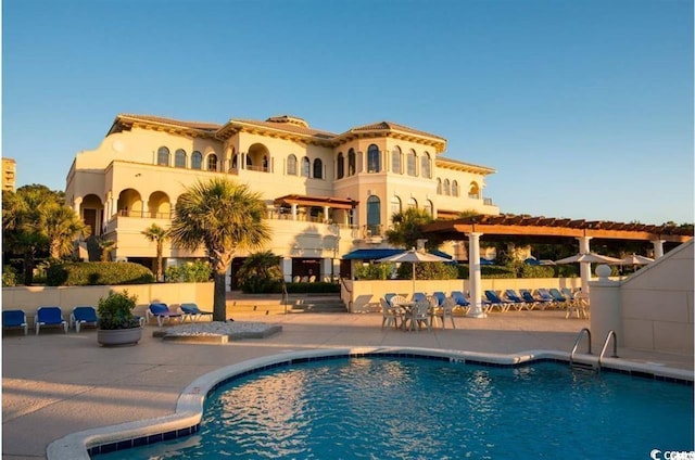 view of swimming pool featuring a patio area