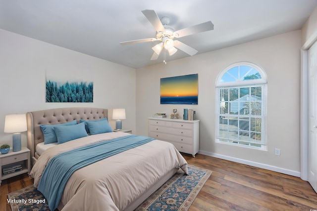 bedroom with ceiling fan and hardwood / wood-style floors