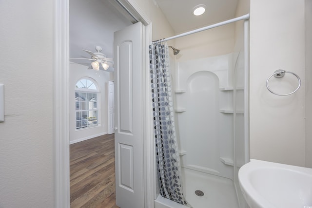 bathroom with sink, wood-type flooring, ceiling fan, and a shower with shower curtain