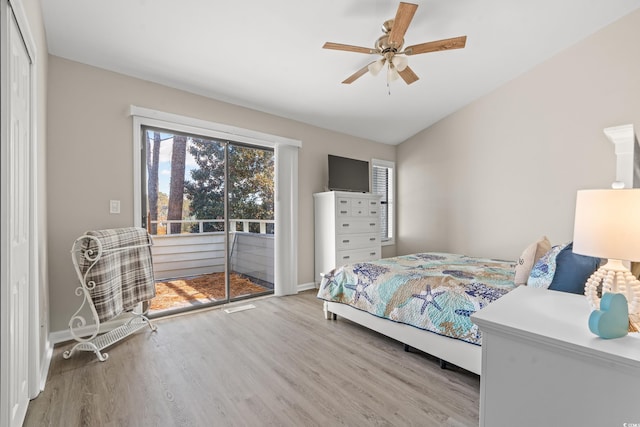 bedroom with ceiling fan, light hardwood / wood-style flooring, and access to outside