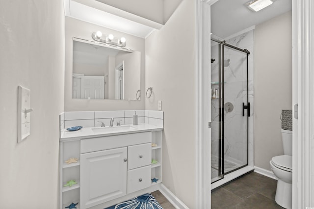 bathroom with vanity, toilet, and walk in shower